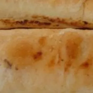 a close up view of a piece of bread on a cutting board