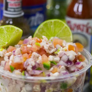 a close up of a bowl of salsa