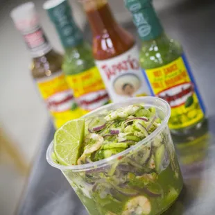a plastic container filled with a salad