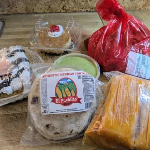 Cakes, tortillas, house carne, guacamole and tamales