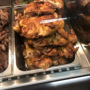 a variety of meats in a display case