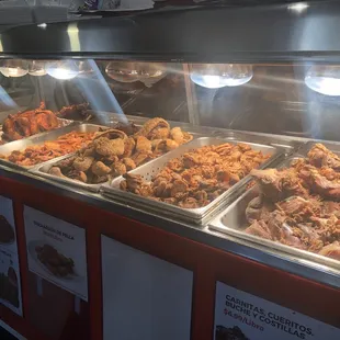 Carnitas, chicharrón, chicken, etc. You pay by weight