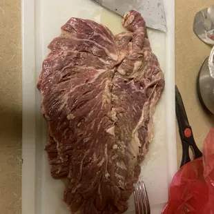 a piece of meat on a cutting board