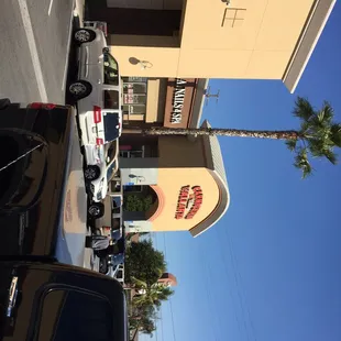 cars parked in front of a restaurant