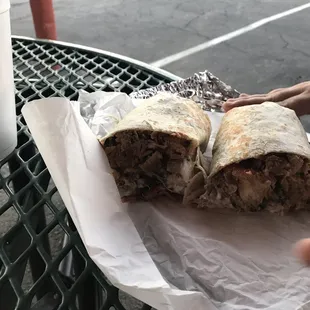 Carnitas burrito loaded with tons of meat enough to share with 2 people!