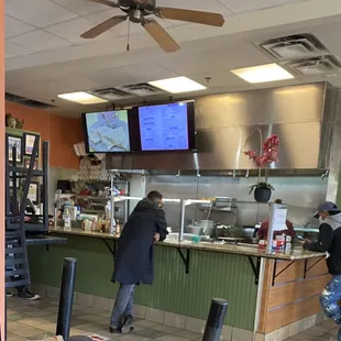 two men working in a restaurant