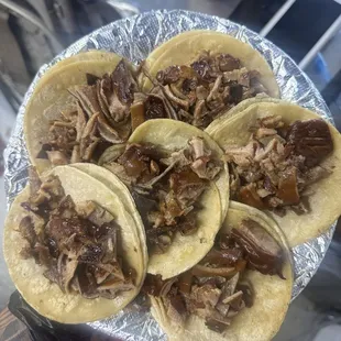a plate of pulled pork tacos