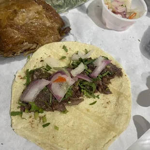 a tortilla with meat and vegetables