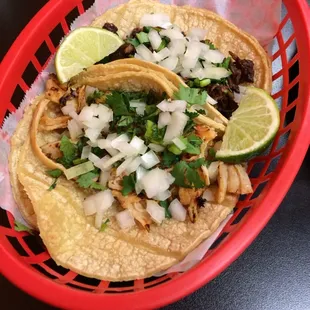 Carnitas (pork) and pollo (chicken) tacos.  $1.80 each