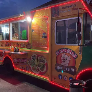 a man standing in front of a food truck