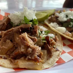 two tacos on a checkered plate