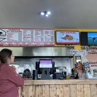 a woman standing at a counter