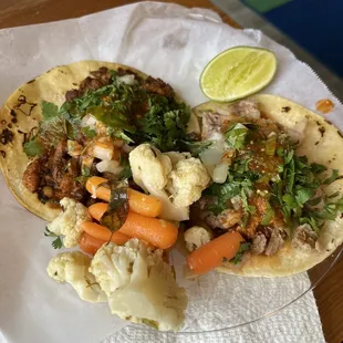 Carnitas Taco and Tacos el Pastor. I don&apos;t know the name of the side dish but the cauliflower and carrots were so good!!
