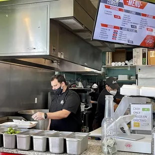 a man preparing food in a restaurant
