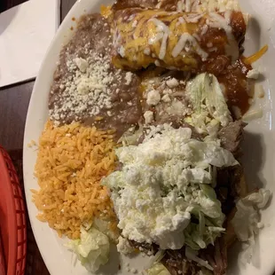 Carnitas Sope and beef enchilada with the typical red rice and beans. This was cold