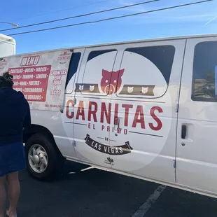 a woman standing in front of a van