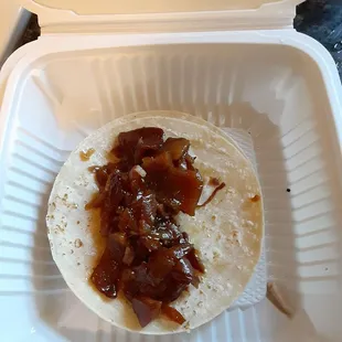 Cuerito taco with absolutely nothing on it even though I asked for everything, tortillas barely warmed up and everything was cold