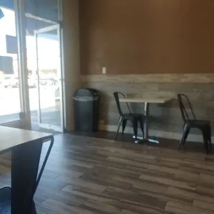 Interior is spacious enough and clean with tables and chairs for dining in.