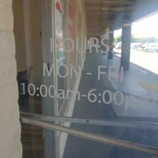 Hours posted on outside door.