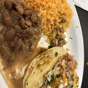 Carnita taco with rice and beans (one taco already devoured)