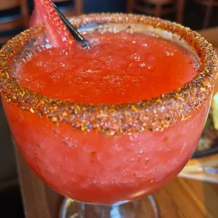 Blended strawberry margarita with tajin rim