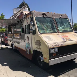 a food truck parked on the side of the road