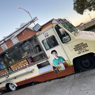 a food truck parked on the side of the road