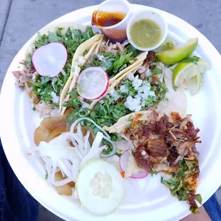 2 carnitas surtida and 2 tacos something