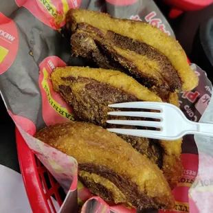 a fork in a basket of food