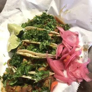 Tacos de carnitas and chicharrón rojo