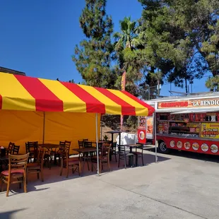 a food truck and tables