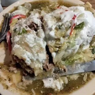 Green salsa wet burrito carnitas /buchi sour cream rice and beans