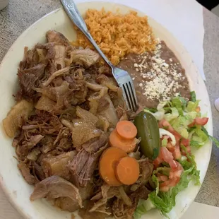 Carnitas plate mixed with cueritos with hand made tortillas . This place is the real deal....