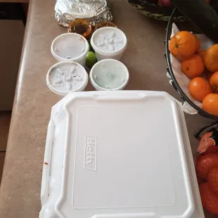 1LB carnitas, 1LB mixto. Only included 1 red, 1 green salsas, onion, cilantro, 2 packages of tortillas. Not to mention 4 whole, mini limes.