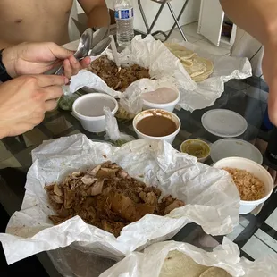 The spread. Carnitas on the left, tortillas on the bottom, beans and rice