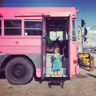 Full of delicious carnitas and making an exit from the big pink bus.