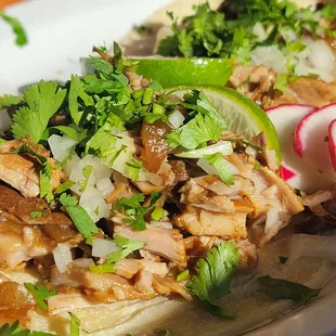 Yup, carnitas mixto tacos!