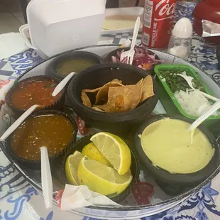 Salsas and taco fillers (cebollita picada, cilantro, pockled purple onion). I preferred the molcajete salsa.
