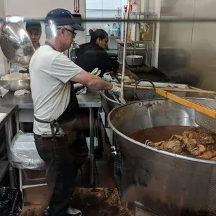 Handmade tortillas. Carnitas being prepared