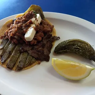 Taco Sahuayo- Hand made tortilla, grilled whole Nopal (cactus) steak, beans, queso, molcajete salsa. That grilled jalapeño blew my head off.