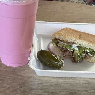 Agua de fresa ..strawberry water , half a torta de carnitas