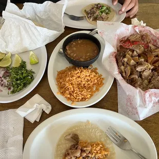 1lb carnitas with rice, beans and tortillas.