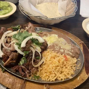 Carnitas plate ft. Homemade tortillas in the background