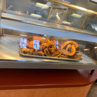 a display case filled with pastries