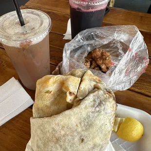 Birria Burritos and homemade tamarind and hibiscus water. She gave us free cicerones to try.