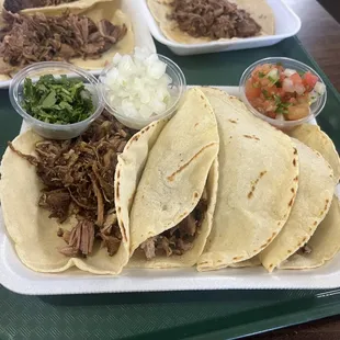 Tacos  carnitas. pico, cilantro  onion
