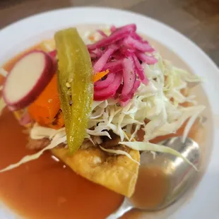 Tacos dorados de papa con carne.