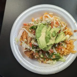 Avocado bowl with fried tilapia.