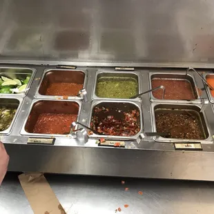 a buffet with a variety of condiments