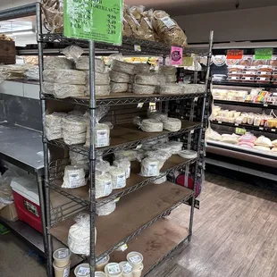 shelves of cheese and other foods